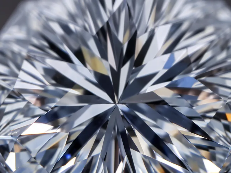 Close up of the intricate facet pattern on a radiant cut diamond